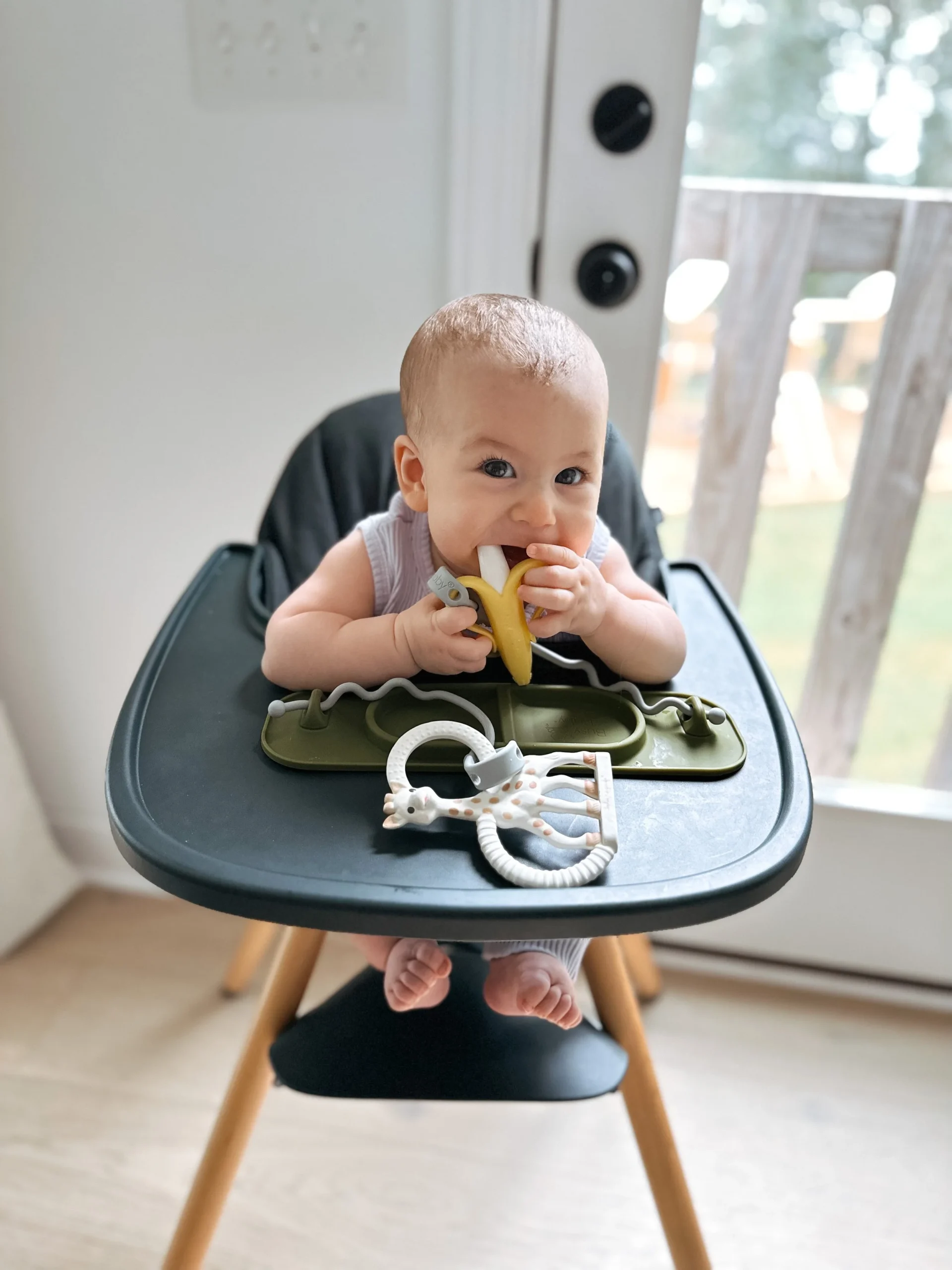 This baby is leaning in the highchair. This baby also isn’t yet sitting independently, so she isn’t ready for solid foods just yet!