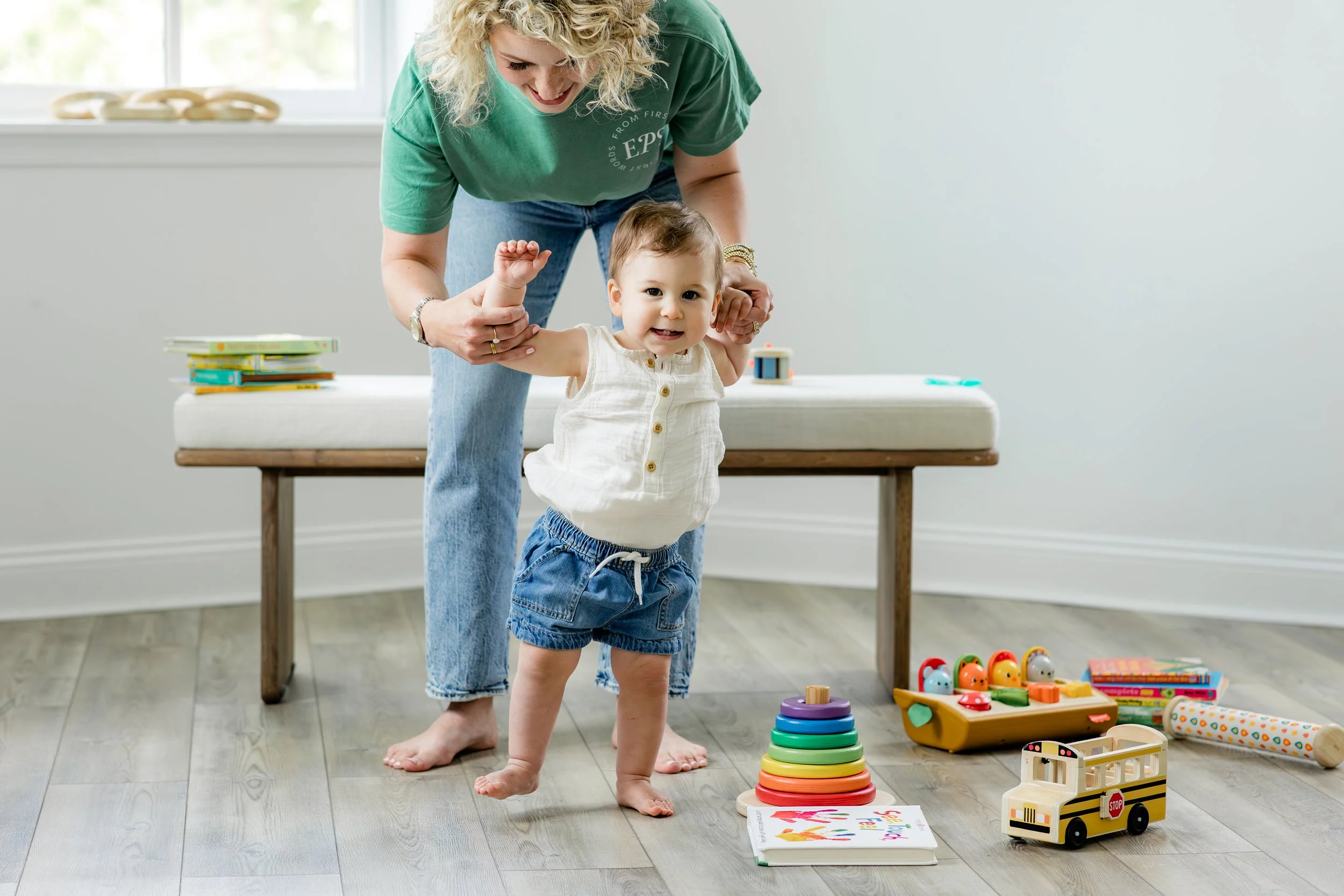  My daughter, Penelope, 14 months, learning how to stand and walk after being delayed with crawling.  