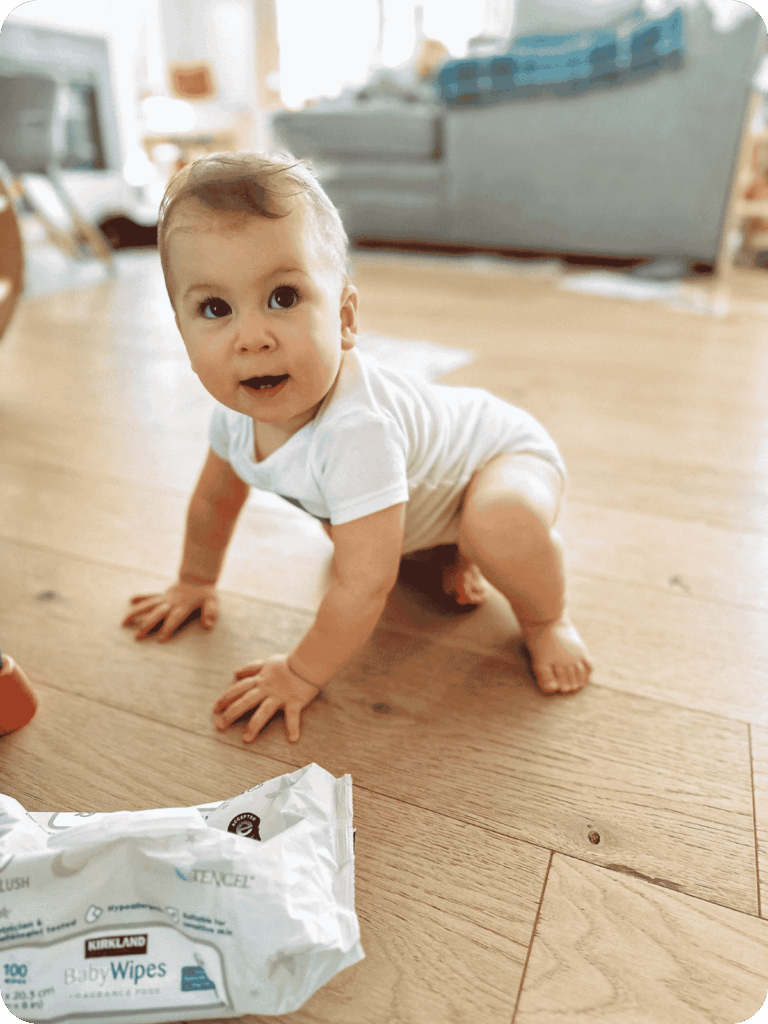 Baby crawls with one knee upward, a common variation of the expected reciprocal crawl.