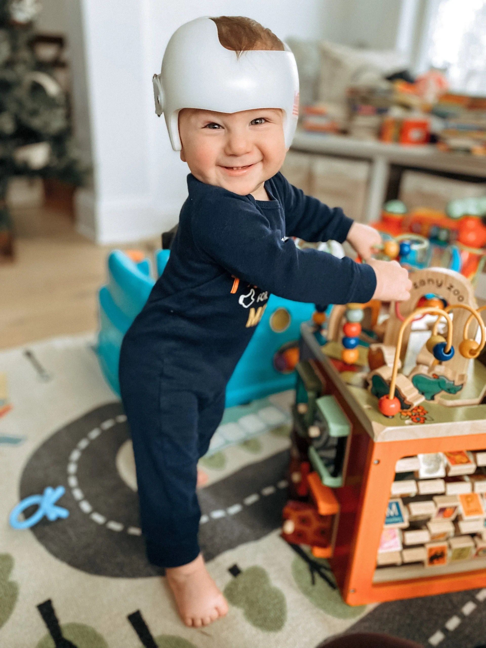  My son, Paul, 10 months old, playing with a wooden activity cube. 