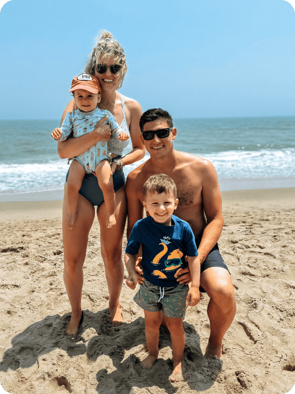 family at the beach in swimsuits