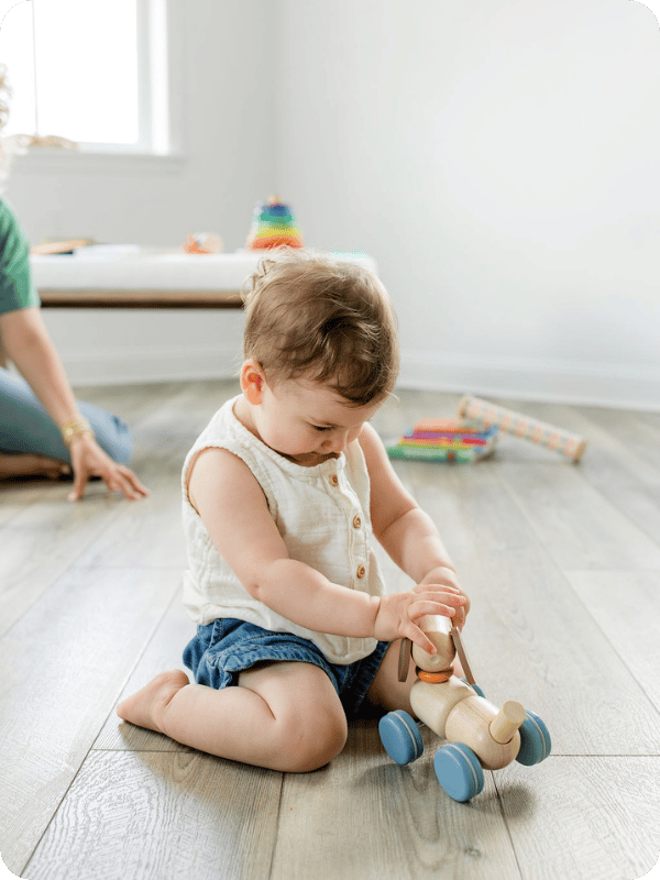 Infant sitting in the W sit