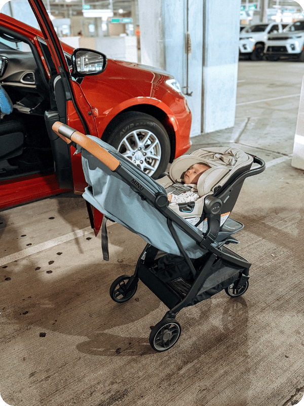 Uppababy Minu stroller being used with Aria car seat adapter
