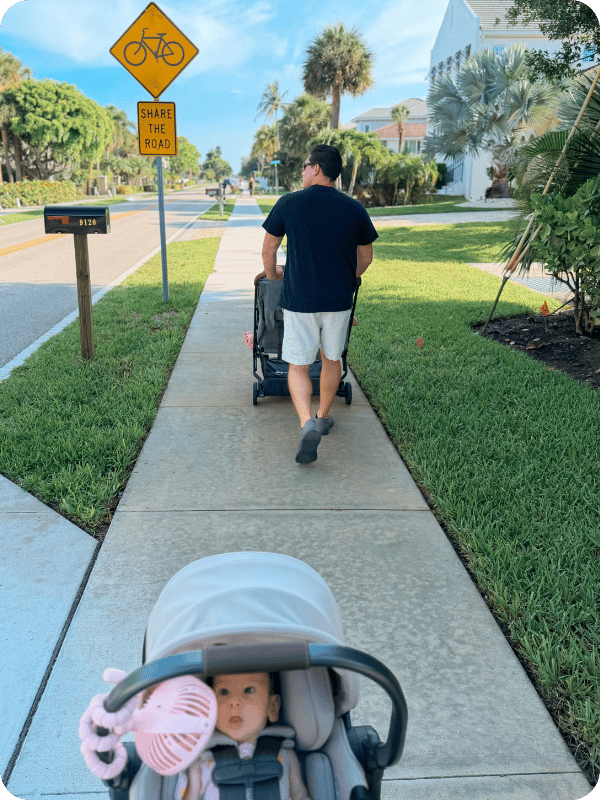 family using Uppababy strollers on a walk