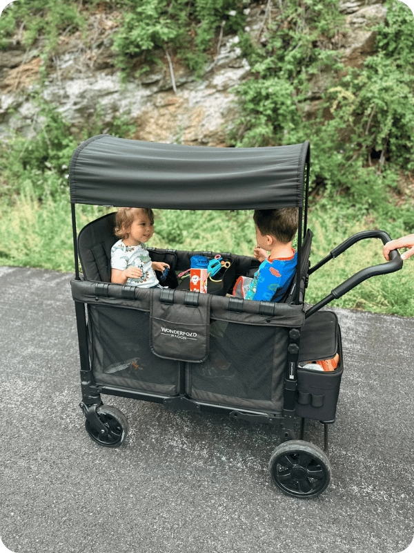 two toddlers in wonderfold wagon
