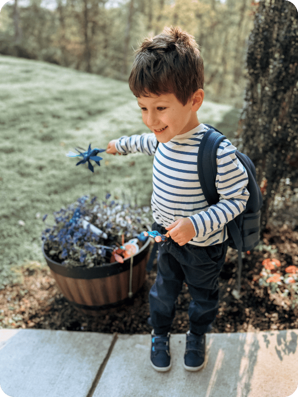 little boy wearing Ten Little sneakers 