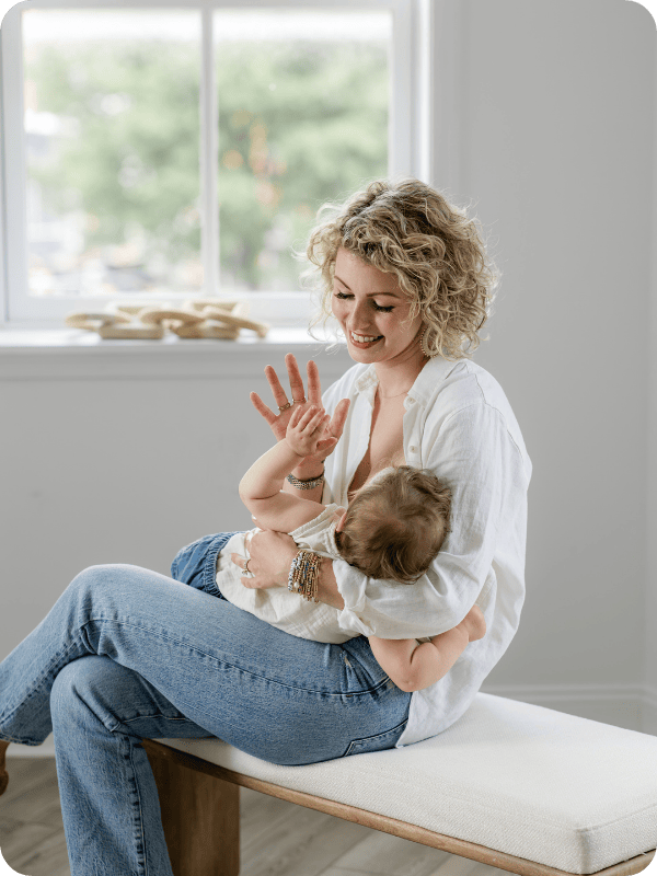Mom breastfeeds baby