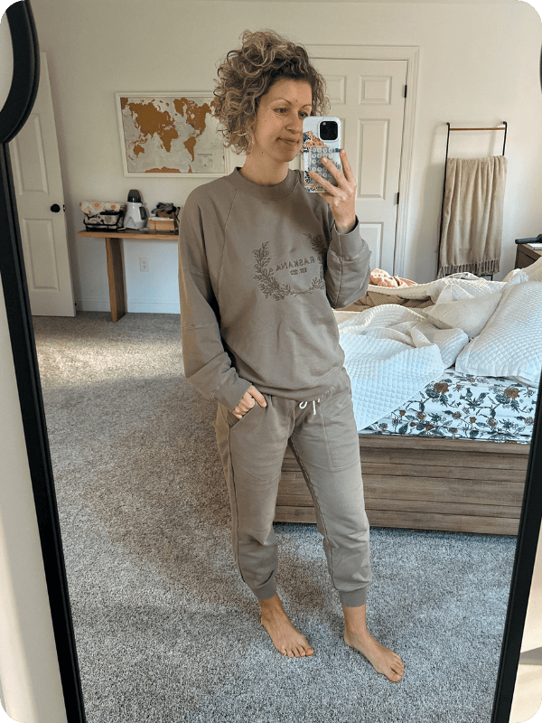 pregnant woman wearing RASKANA cotton joggers styled with matching sweatshirt