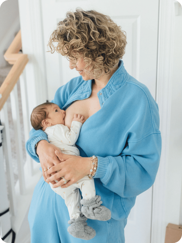 Mom breastfeeds her newborn