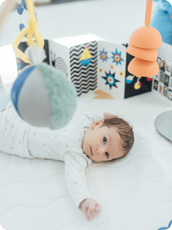 Newborn in her Lalo Play Gym II