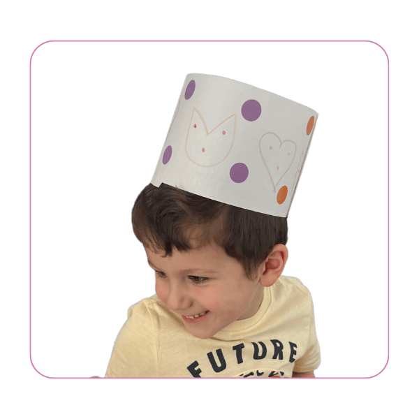 boy wearing valentine's day craft hat