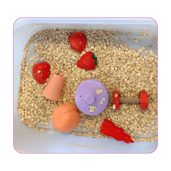 red and pink sensory bin