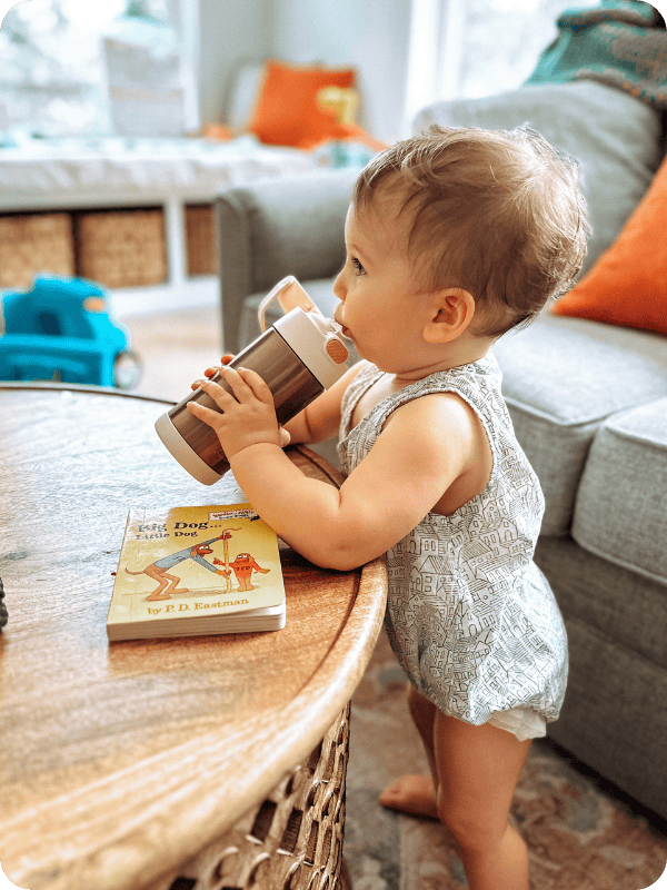 toddler drinking from thermos funtainer