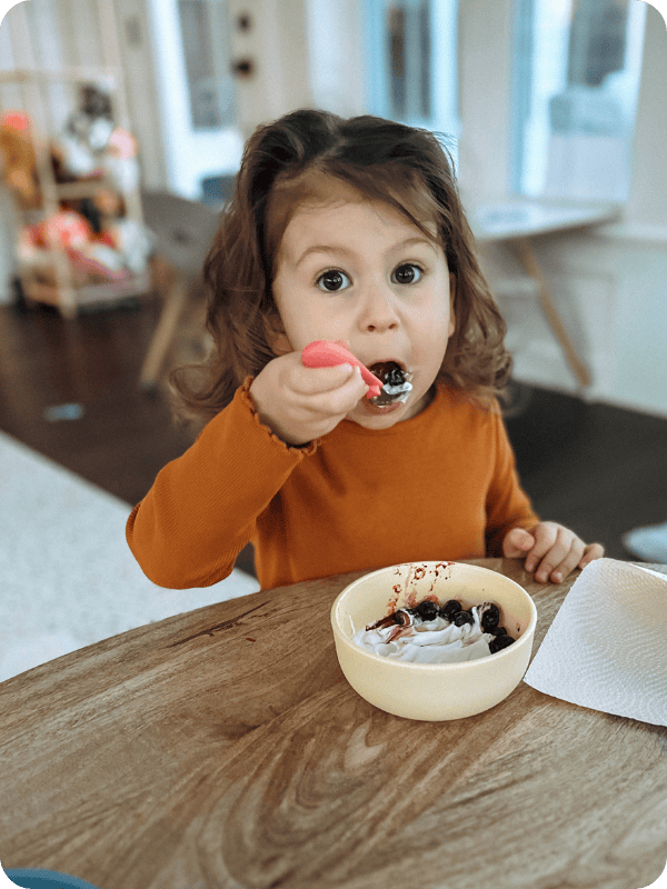 toddler using Elk and friends kids silverware