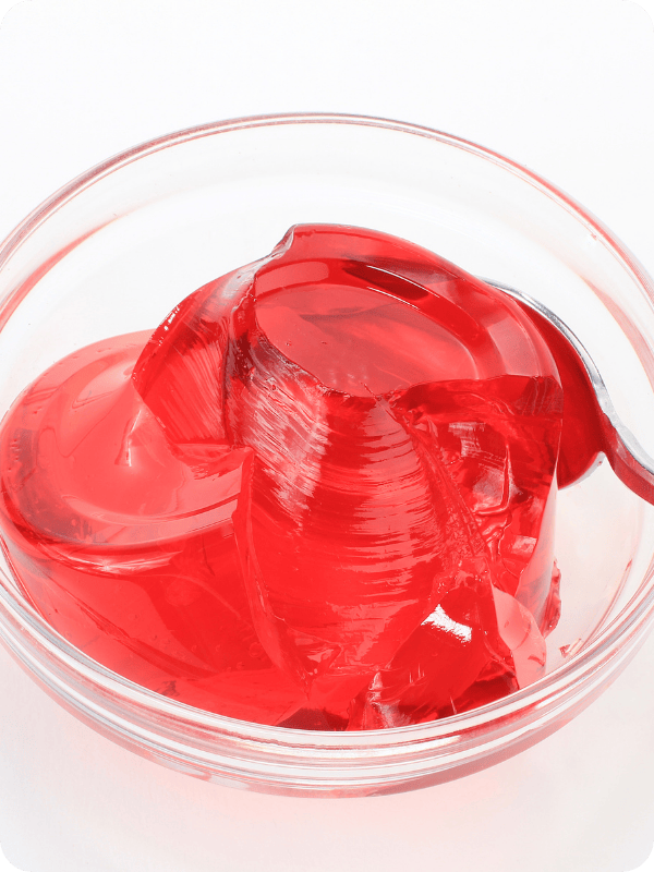 Cherry red juice gelatin bites in a bowl