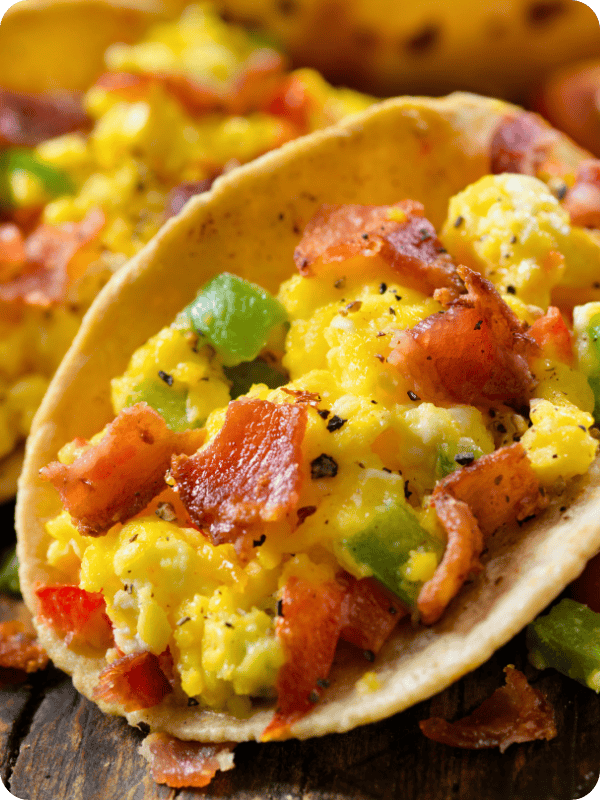 Breakfast taco filled with eggs and bacon