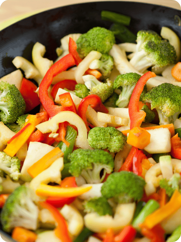 vibrant stir fry veggies in a wok