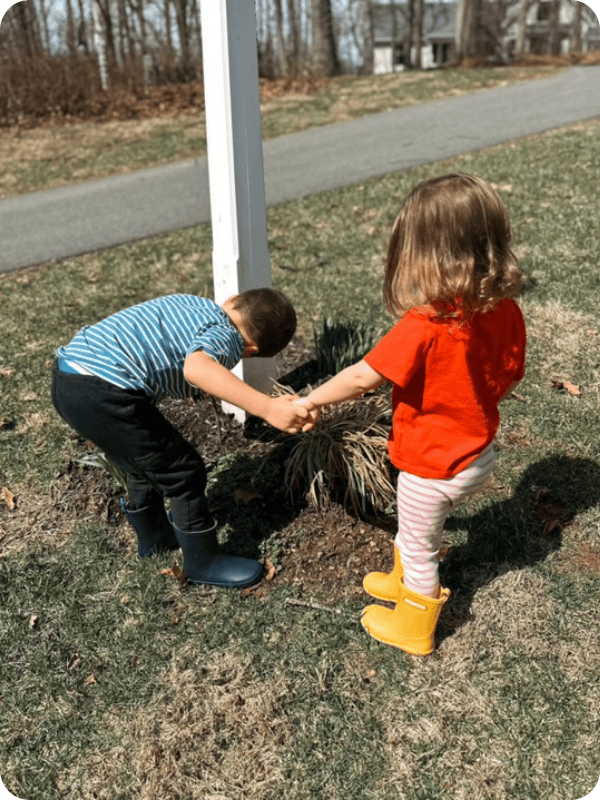 toddlers playing outside in waterproof rainboots