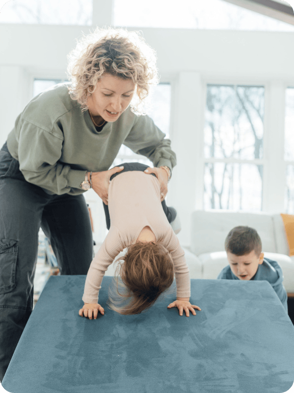 a toddler tumbling on the figgy play couch