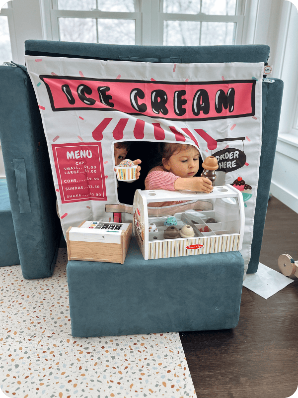 toddlers playing with ice cream truck play couch panel