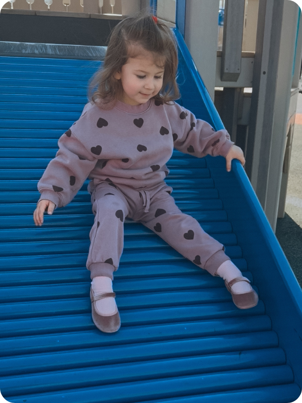 toddler girl wearing Ten Little ballet flats at the park