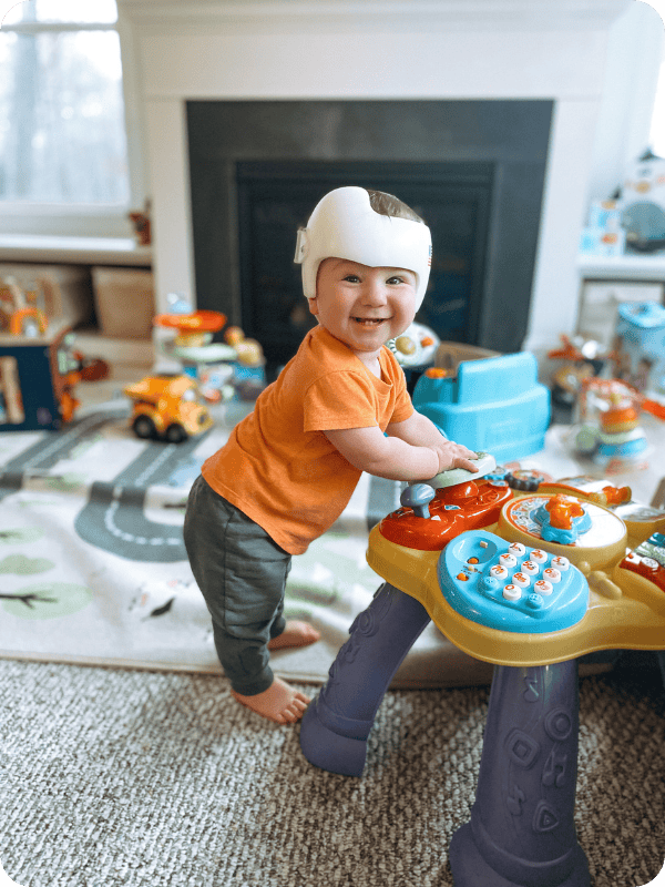 Infant stands at a light up music table toy