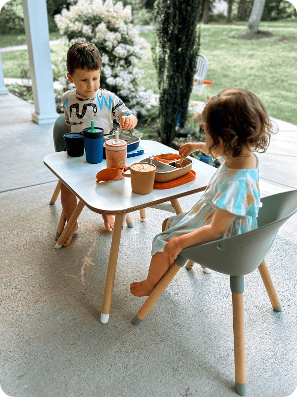 toddlers eating outside on Lalo table and chairs
