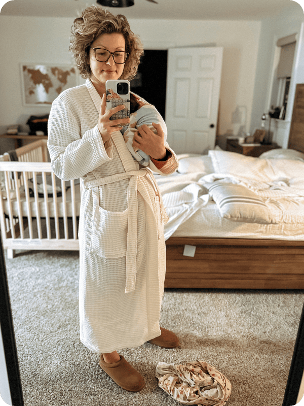 mom in a robe wearing Bombas Saturday slip ons 