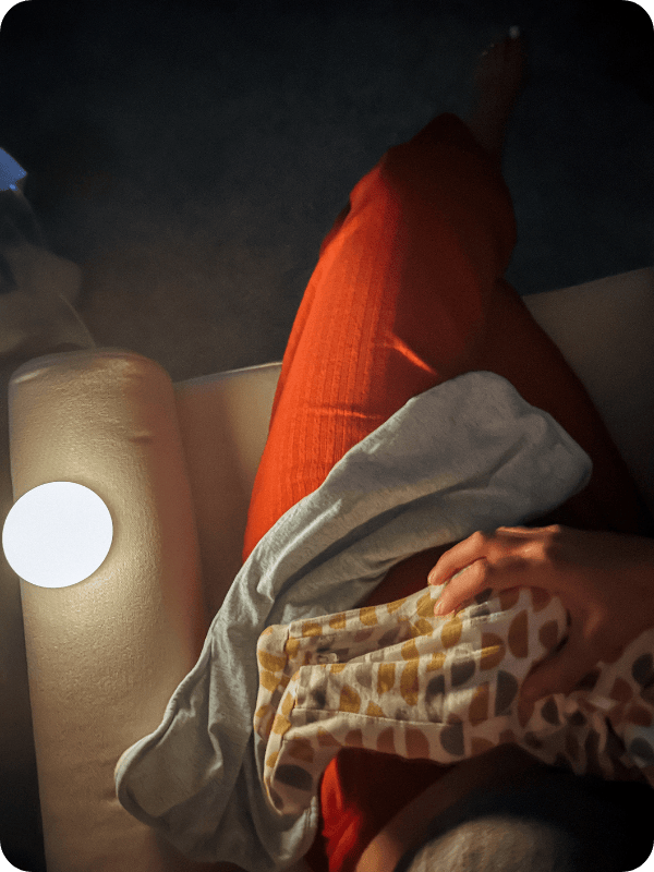 mom using dimmable night light for nighttime feeding