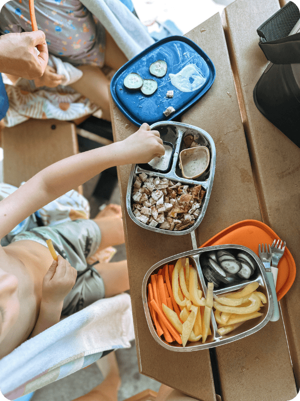 stainless steel bento box being used at the pool