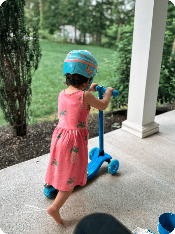 toddler girl riding GoTrax kids scooter