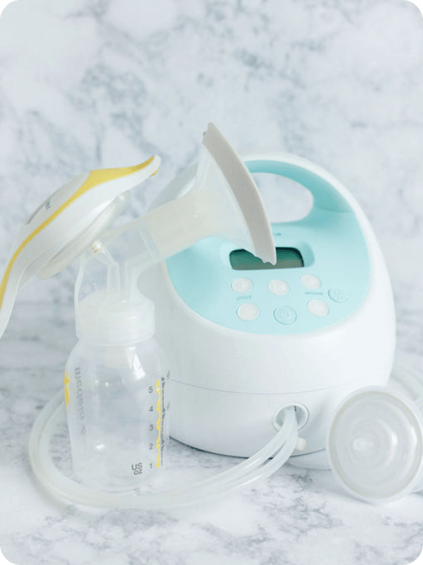Medela hand pump beside the Spectra S1.