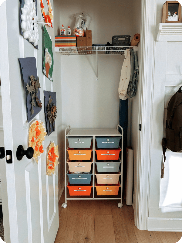 Craft cart tucked into a hall closet