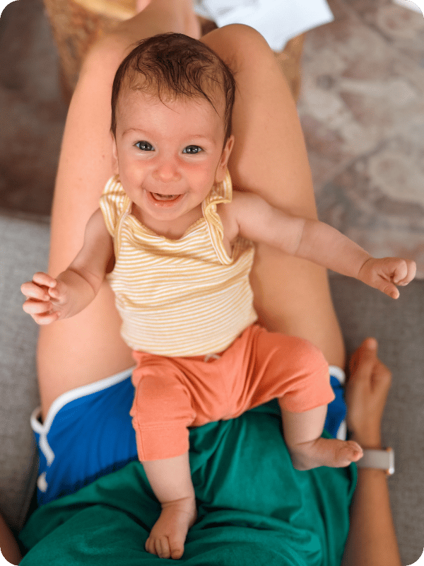 Baby smiles at the camera