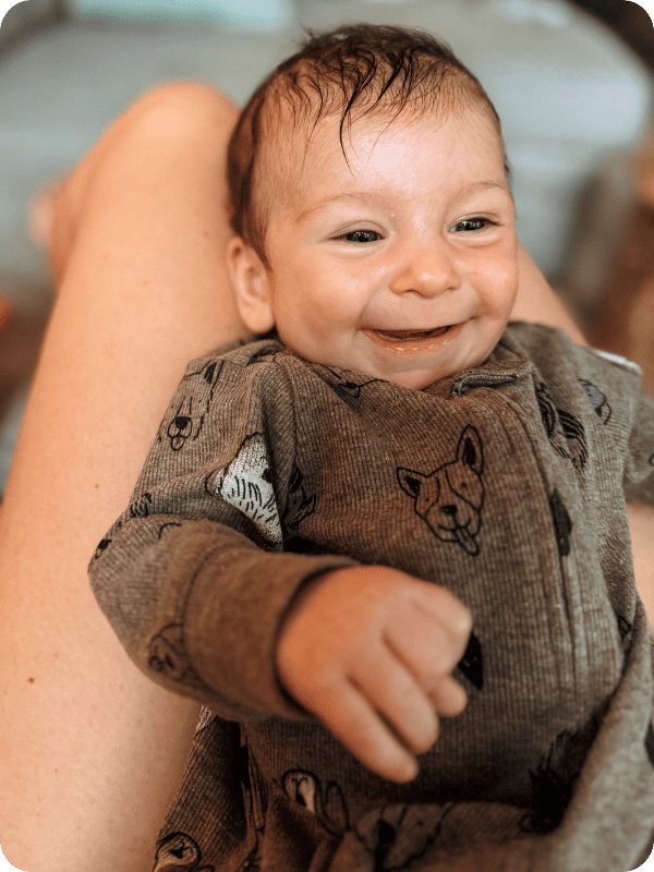 Baby smiles at mom