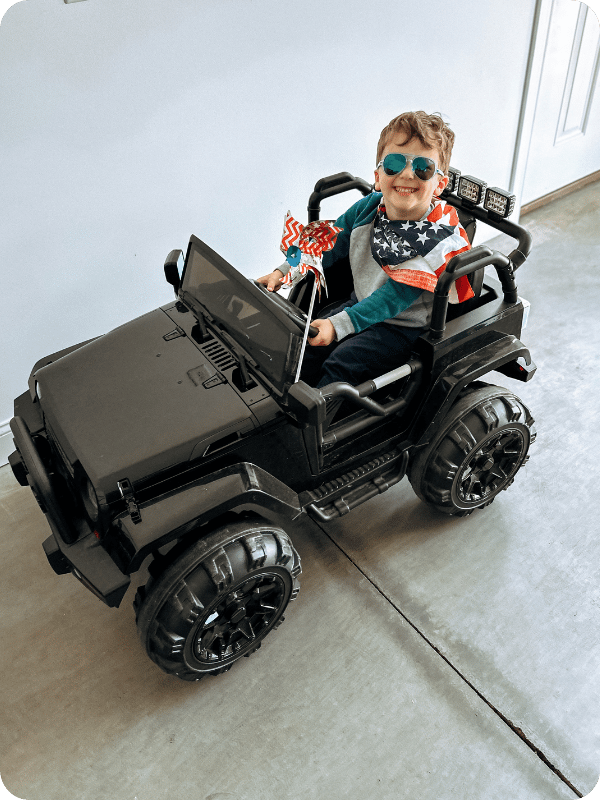 toddler on a ride on car
