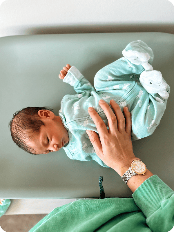 newborn baby on Lalo changing pad