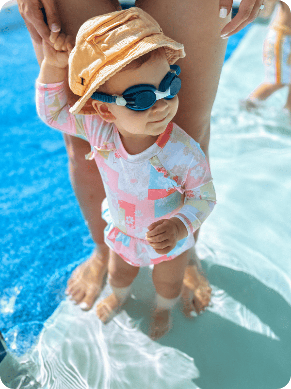 baby at the pool with goggles on