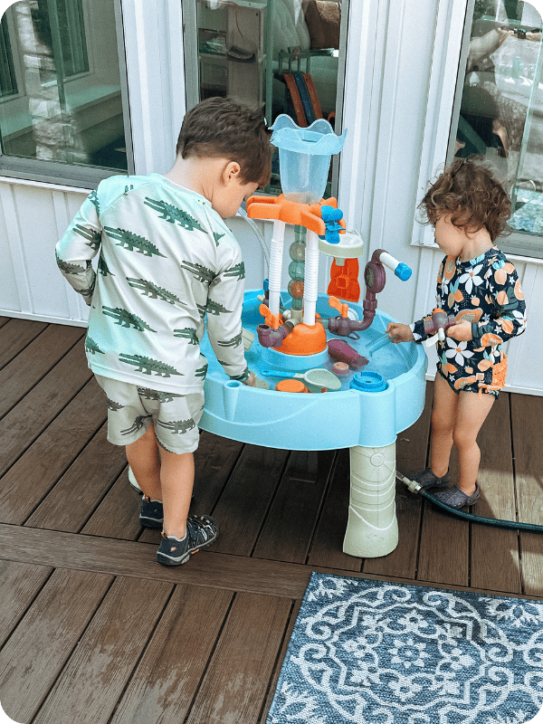 kids playing at little tikes water table