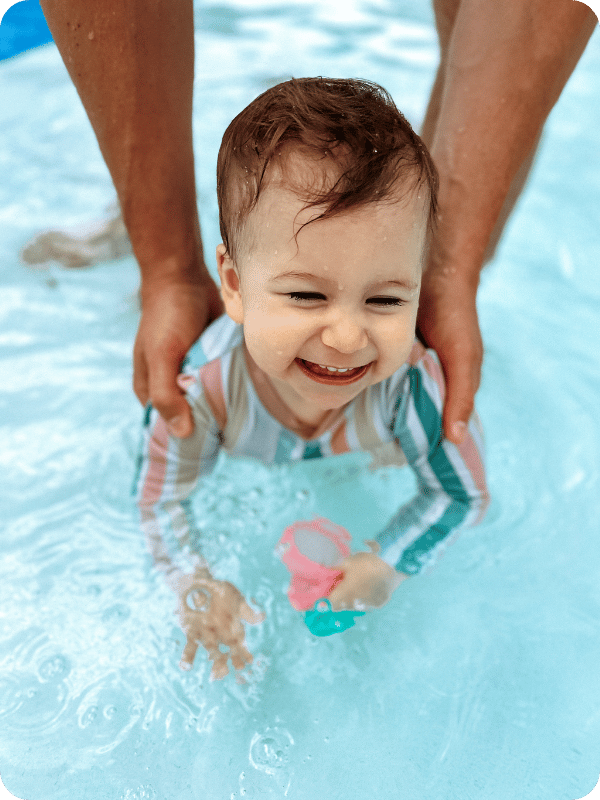 toddler swimming in a pool