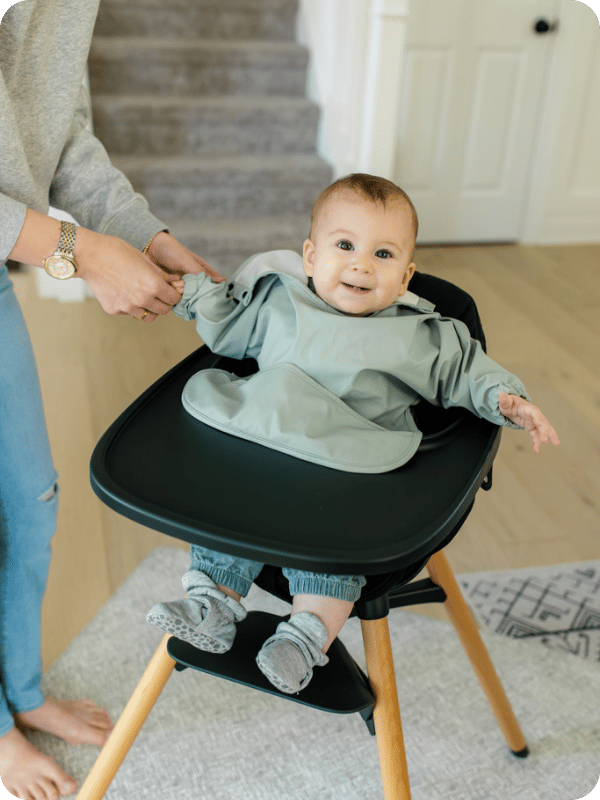 Baby gets ready for a meal in the high chair