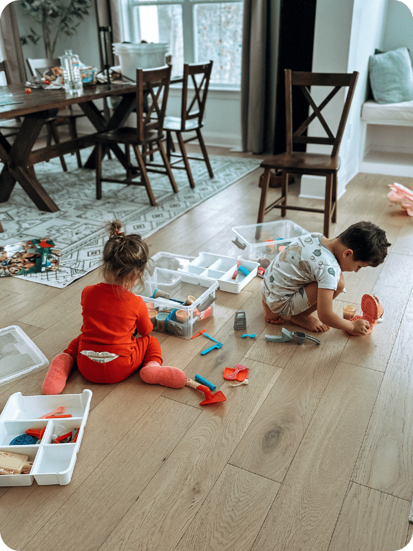 toddler playing with play doh dentist set