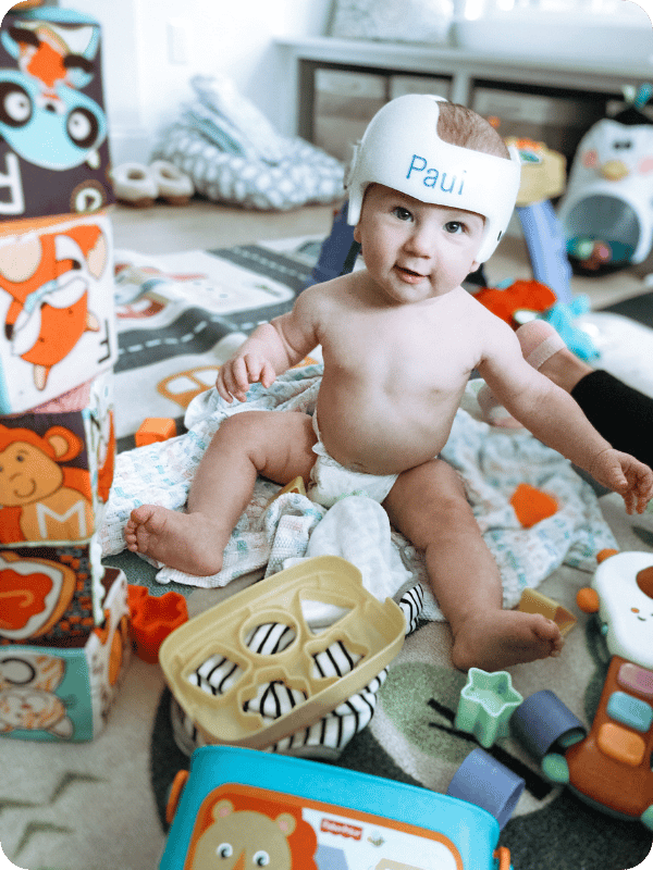 baby playing with shape sorter and soft blocks