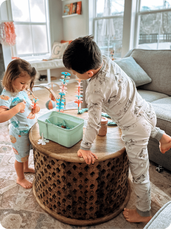 toddlers playing with flower garden building toy