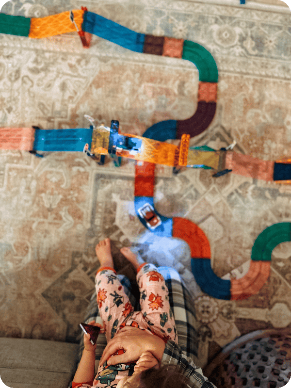 family playing with Magnetic Tile Race Track from Picasso Tiles