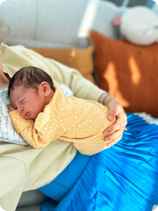 Newborn sleeps on mom's chest